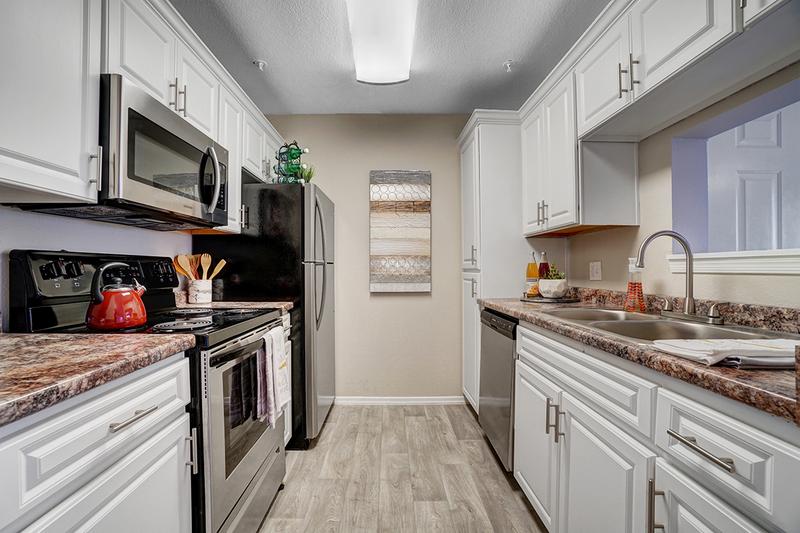 Galley Style Kitchens | If you love to cook, then our galley-style kitchen is perfect for you, equipped with stainless steel appliances and plenty of counter space!