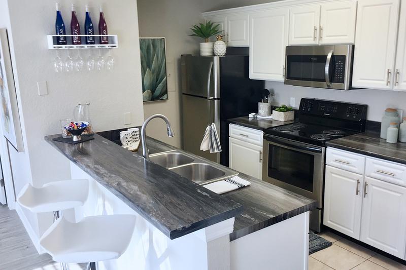 Breakfast Bar | Kitchens feature a breakfast bar overlooking the living area.
