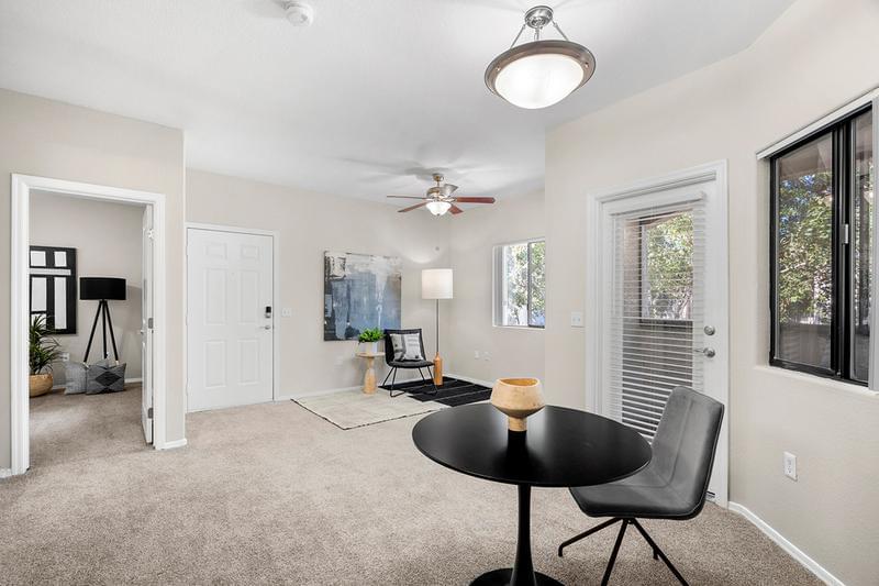 Living Room | Spacious living rooms featuring wood-style flooring, and multi-speed ceiling fans.