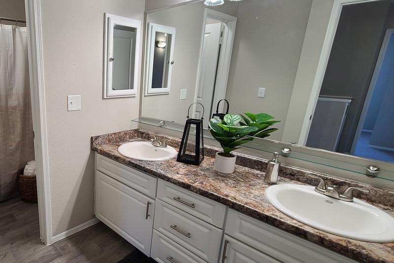 Bathrooms | Our bathrooms feature granite-style countertops and tons of storage space.