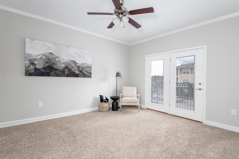 Master Bedroom with Balcony | Master bedrooms featuring multi-speed ceiling fans, walk-in closets, an doors leading to your very own private balcony.