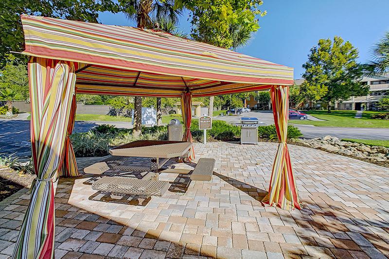 BBQ Area | Residents can gather and grill poolside with fellow Gators and enjoy the Florida sunshine.