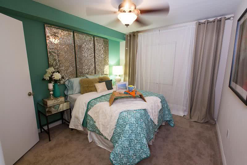 Bedroom | Your spacious bedroom features a modern ceiling fan and walk-in closet.