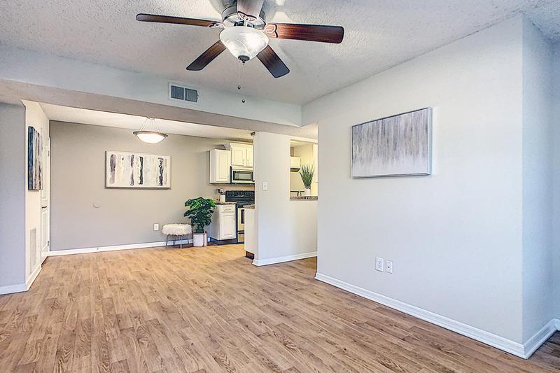 Spacious Open Floor Plans | Spacious open floor plans featuring wood-style flooring and multi-speed ceiling fans.
