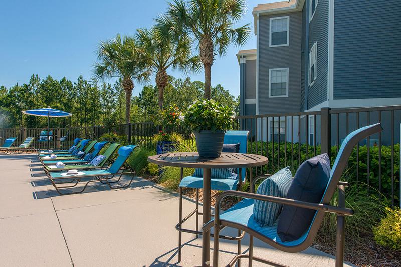Poolside Tables | There is plenty of poolside tables and seating for your convenience.