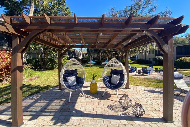 Poolside Pergola | Relax under our poolside pergola and enjoy some fresh air.