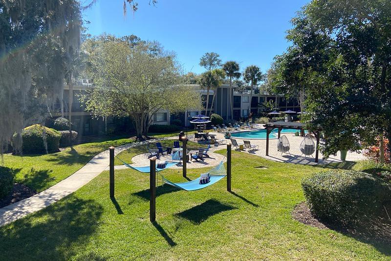 Outdoor Amenities | At Lakewood Village, you can enjoy plenty of outdoor amenities like a hammock garden, fire pit, and resort-style pool.