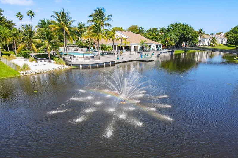 Beachside Views | Enjoy the beach with a view out toward our own community lake fountain.