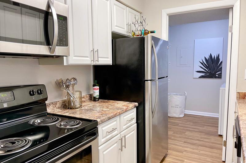 Kitchen | Beautiful stainless steel appliances and marble style countertops included in every kitchen.