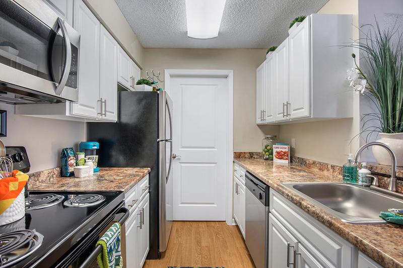 Kitchen | Beautiful stainless steel appliances and marble style countertops included in every kitchen.
