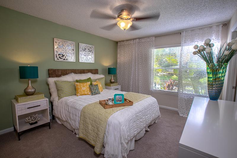 Master Bedroom | Spacious master bedrooms featuring a ceiling fan and walk-in closet.