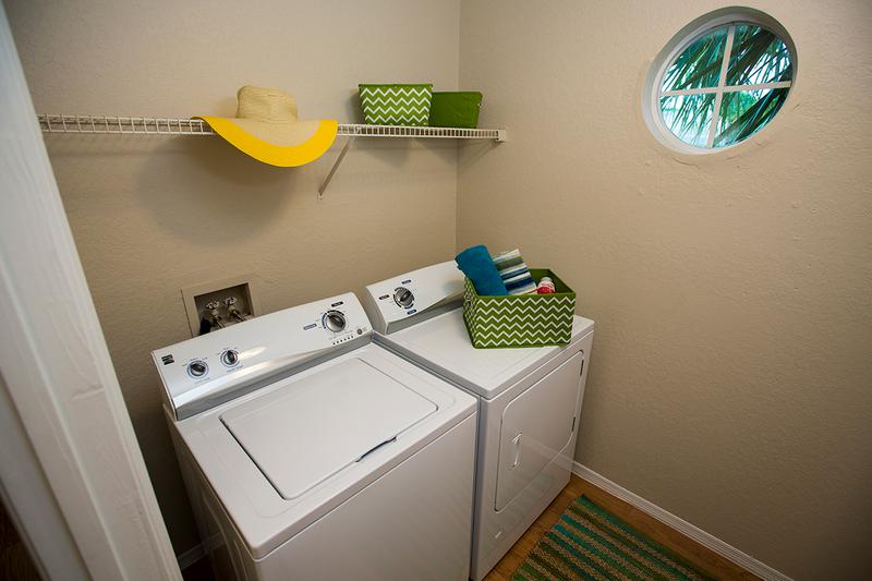 Laundry Room | Extra storage space and full-size washer and dryer appliances.