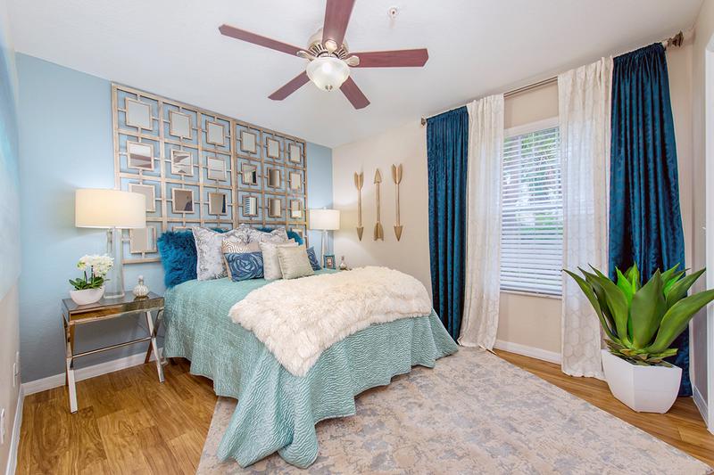 Guest Bedroom | Guest bedroom featuring wood-style flooring and large closets.