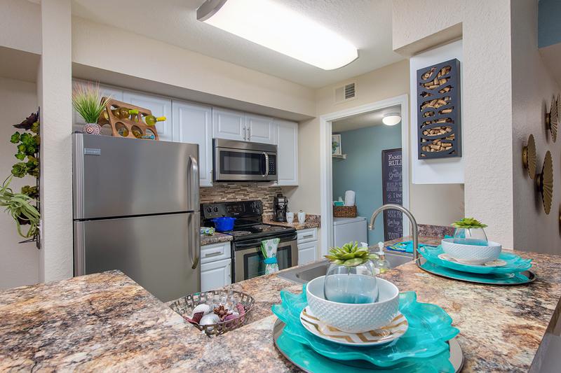 Kitchen with Breakfast Bar | Contemporary kitchens with breakfast bars, ideal for casual dining or entertaining. Laundry room is located next to the kitchen.