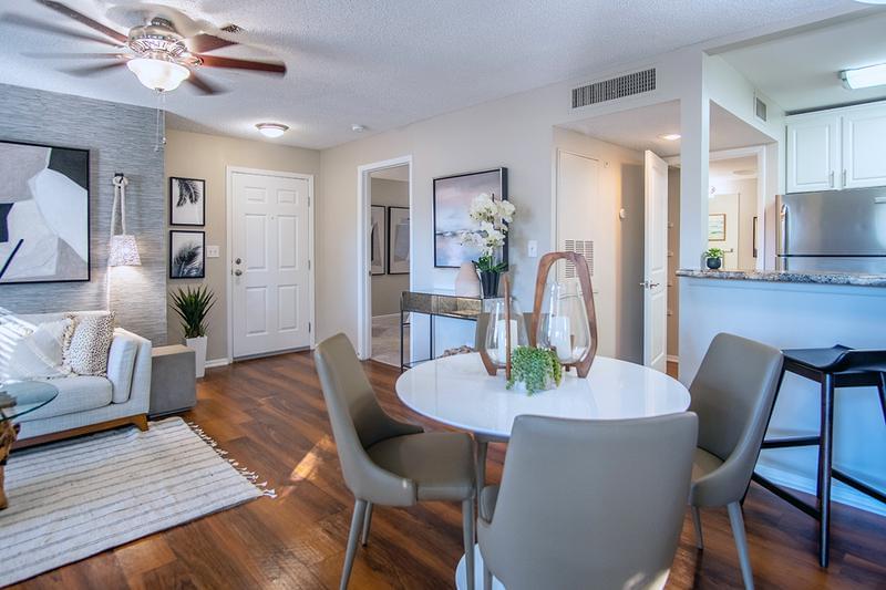 Dining Area | Our dining and living area features wood-style flooring and a ceiling fan.