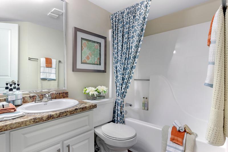 Guest Bathroom | Guest bathroom offers a great deal of counter space along with two entrances so guests never have to enter a bedroom to gain access.