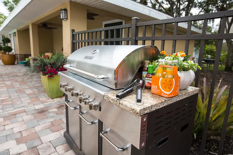 Gas Grill | Have a cookout with some friends next to the pool with our gas grill.