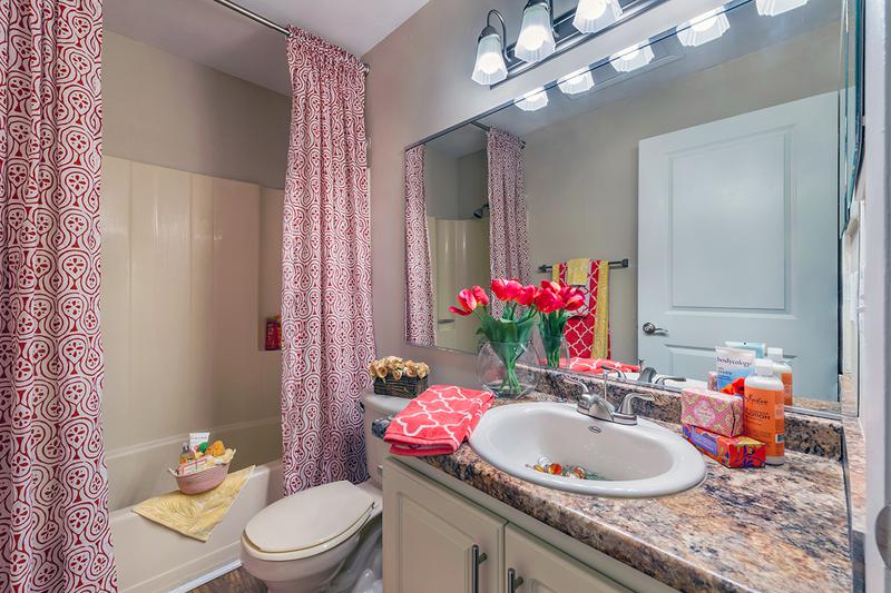 Bathroom | Spacious, newly renovated bathrooms featuring new countertops and cabinetry.