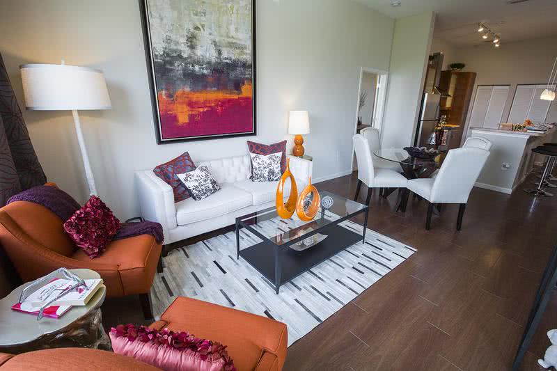 Living/Dining Room | Spacious living and dining areas with wood-style flooring.