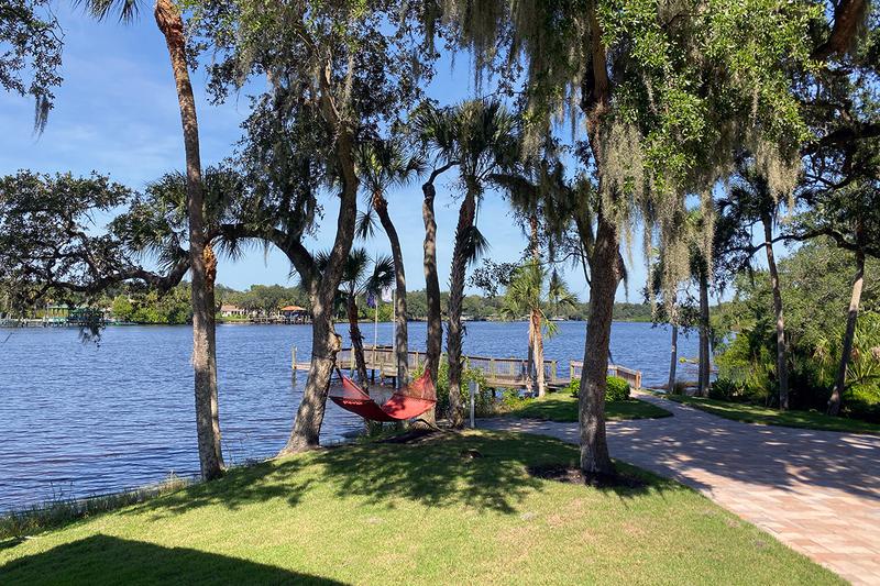 Waterfront Living | Enjoy our lakeside hammocks and boat dock access.