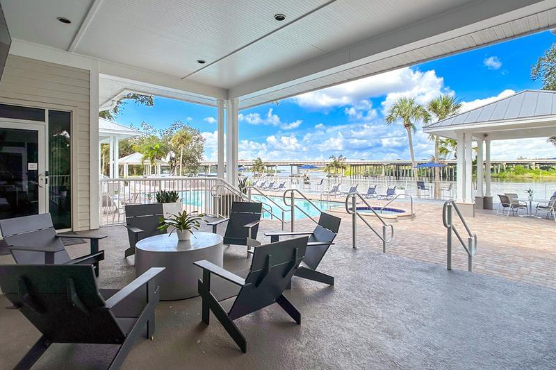 Outdoor Fireplace/TV Lounge | Watch the game while relaxing by the pool in our poolside lounge.