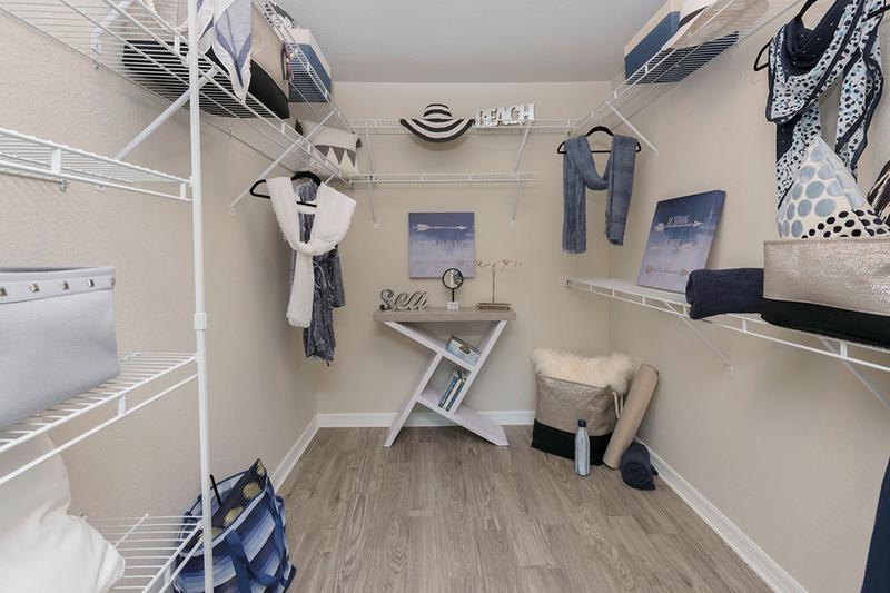 Master Bedroom Walk-In Closet | Master bedrooms feature large walk-in closets with built-in shelving.