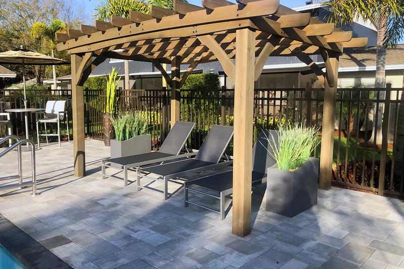 Poolside Pergola | Relax in the shade under our poolside pergola.