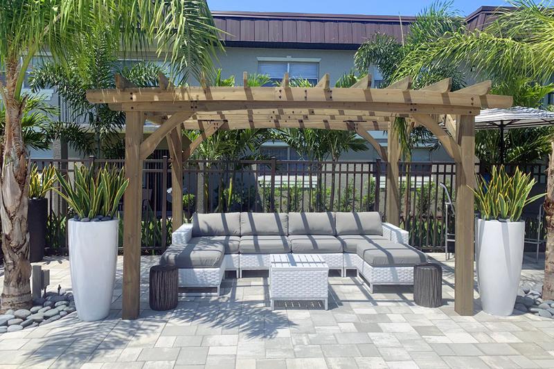 Poolside Pergola | Relax on our expansive sundeck under our poolside pergola.