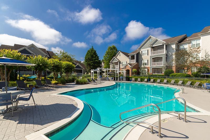 Expansive Sundeck | Relax at our expansive sundeck featuring plenty of poolside seating.