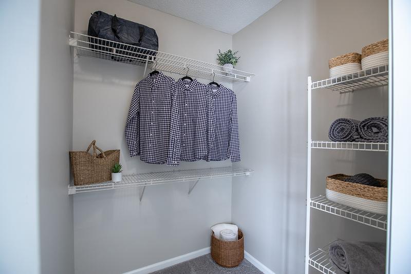 Guest Bedroom Walk-In Closet | Bedrooms feature spacious walk-in closets with built-in organizers.