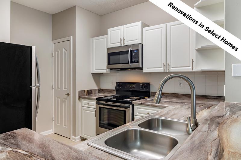 Renovated Kitchens | Our newly renovated kitchens feature black fusion countertops and stainless steel appliances.