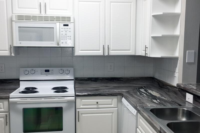 White Appliances | You're sure to love your fully renovated kitchen featuring white cabinetry and white appliances.