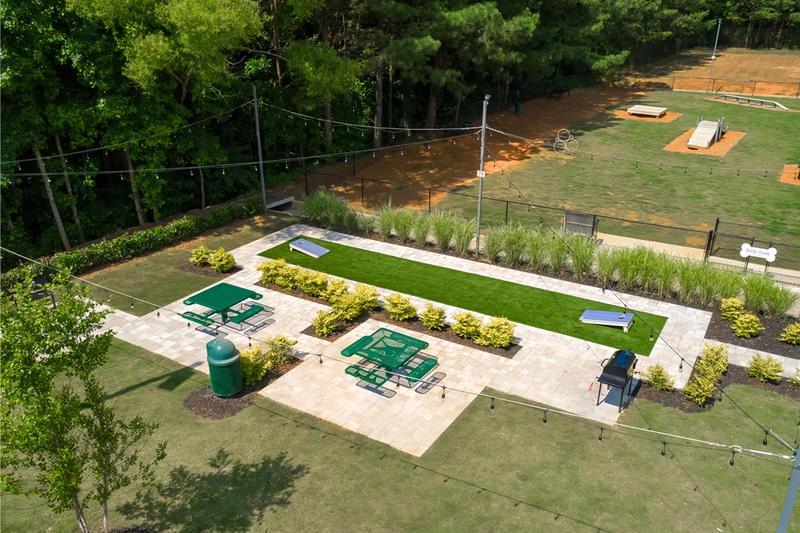 Cornhole and Picnic Area | Have a cookout at our picnic area complete with picnic tables and a grill. Play a game of cornhole after you eat.