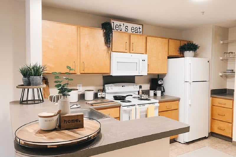 Kitchen | Kitchens come fully applianced and features a built-in pantry area and breakfast bar.