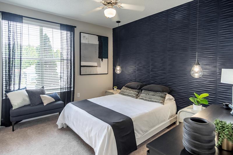 Guest Bedroom | Spacious, bedrooms featuring plush carpeting, multi-speed ceiling fans, and large windows.