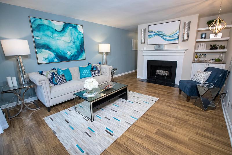 Fireplace | Your living room is complete with a fireplace and built-in shelving.