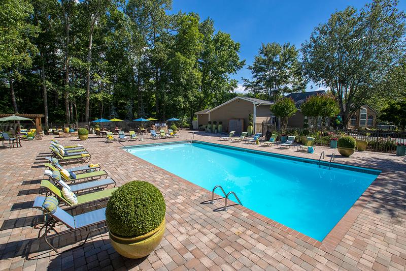 Expansive Sundeck | Lay out in our brand new expansive sundeck featuring poolside loungers and tables with umbrellas.