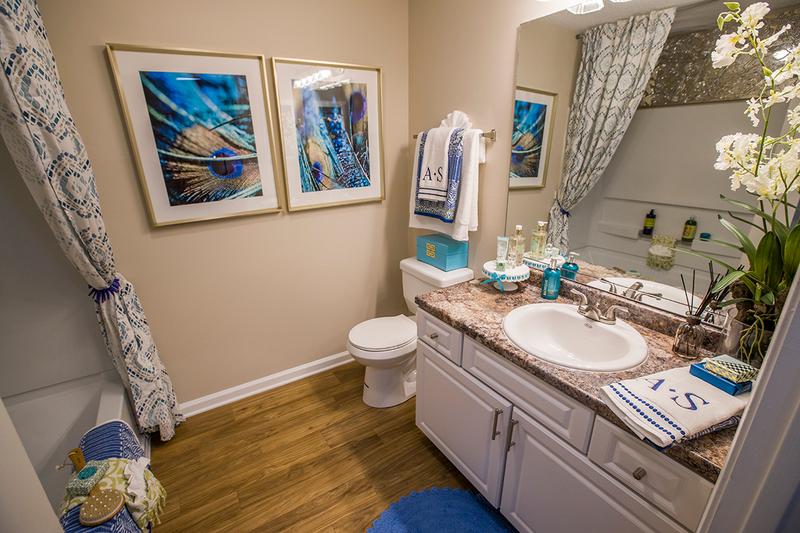 Granite-Style Bathroom | Our spacious bathrooms are fully renovated and feature large mirrors.