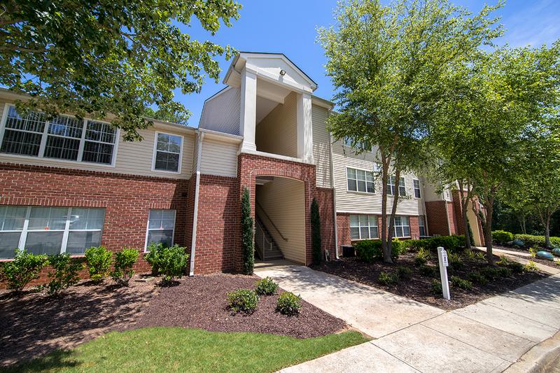 Building Exterior | You'll be welcomed home with lush landscaping.