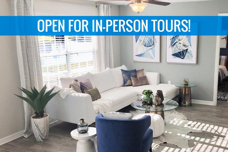 Spacious Living Rooms | We are excited to offer in-person tours while following social distancing and we encourage all visitors to wear a face covering. Spacious living rooms with wood-style flooring and a ceiling fan.