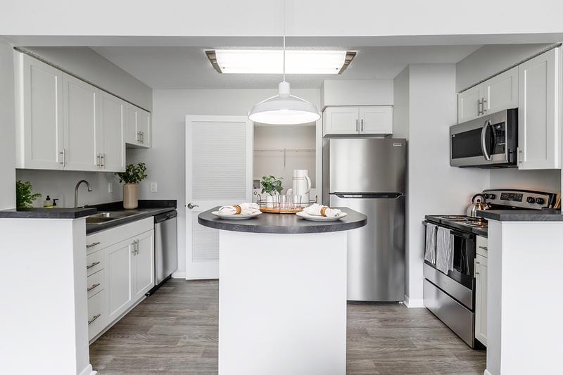 Kitchens with Slate Inspired Countertops* | Our spacious open layouts allow you to entertain while cooking.