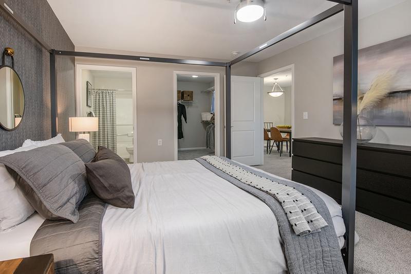 Master Bedroom | Spacious master bedrooms featuring plush carpeting and ceiling fans.