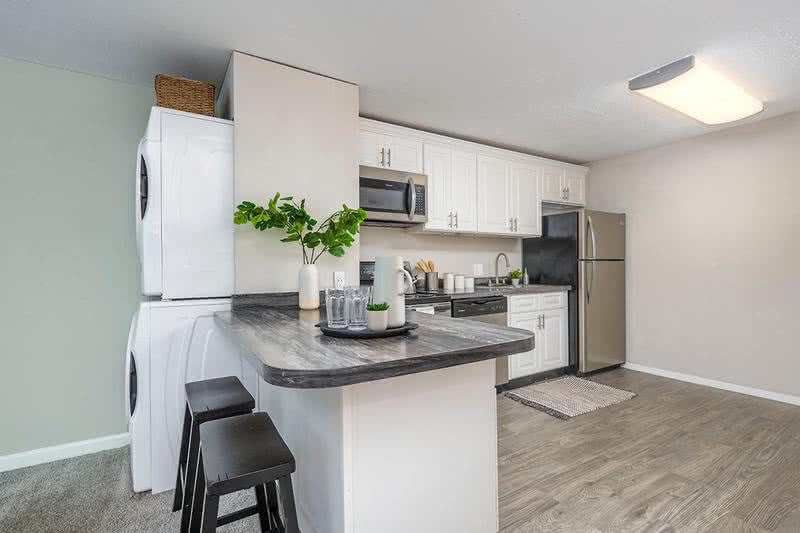 4 Bed 2 Bath Kitchen | Our spacious kitchen comes fully applianced in stainless steel and offers ample cabinet space.