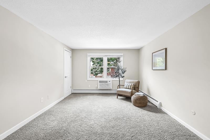 Living Room | Spacious, open living rooms featuring plush carpeting.
