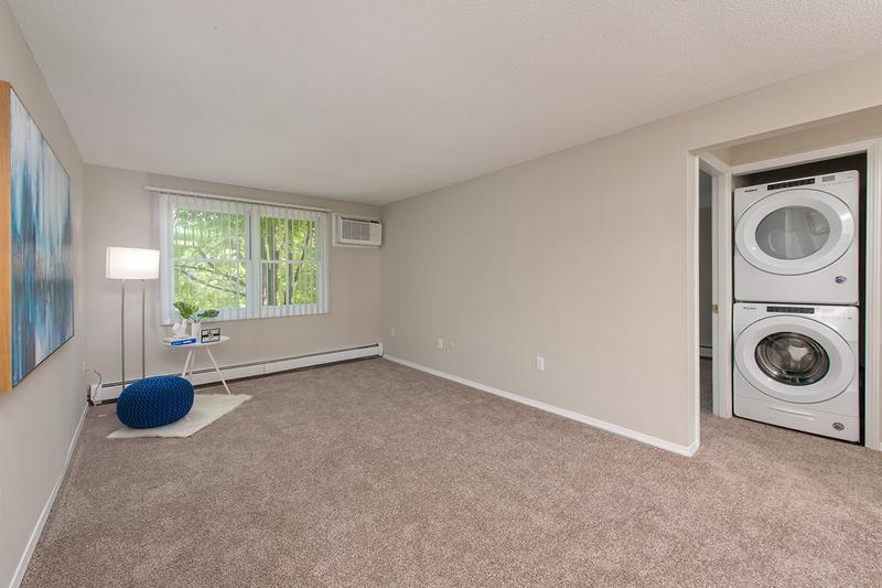 Living Room | Enjoy your bright, spacious living room featuring plush carpeting.