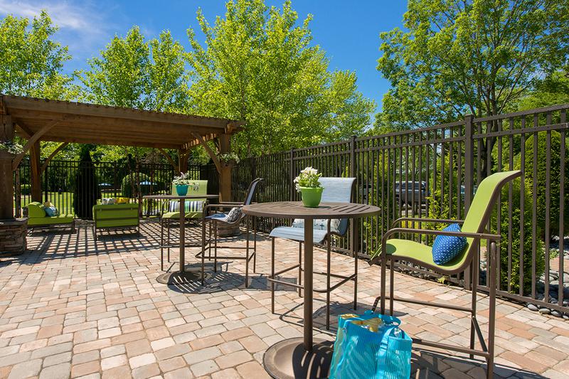 Poolside Tables | Our expansive sundeck features plenty of poolside tables and a gas grill.