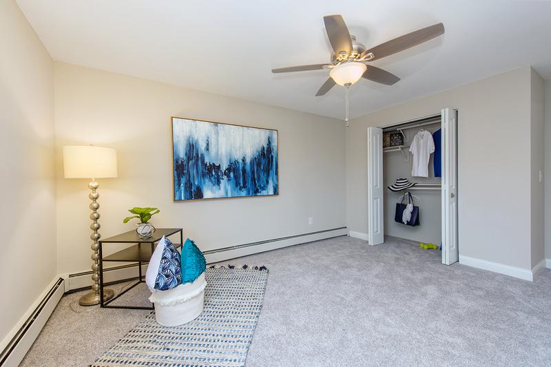 Spacious Bedroom | Spacious bedrooms with plush carpeting and a ceiling fan.