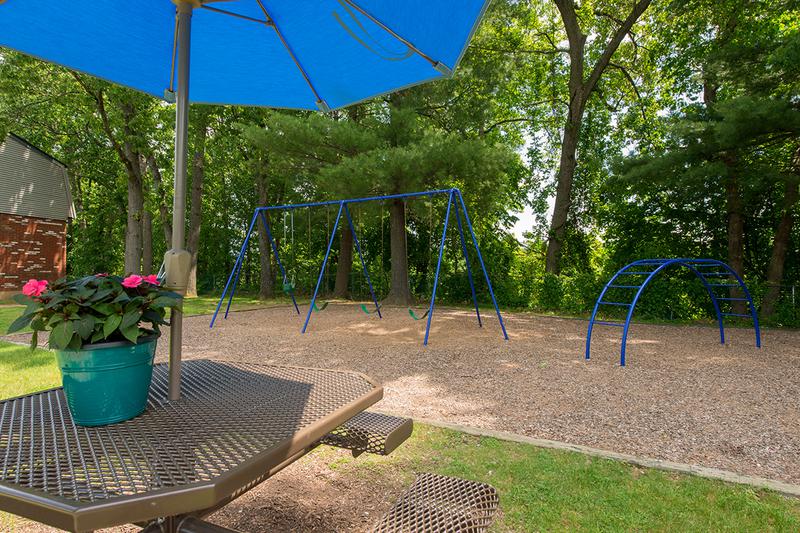 Picnic Tables | Sit under our shaded picnic tables or enjoy our on-site playground.