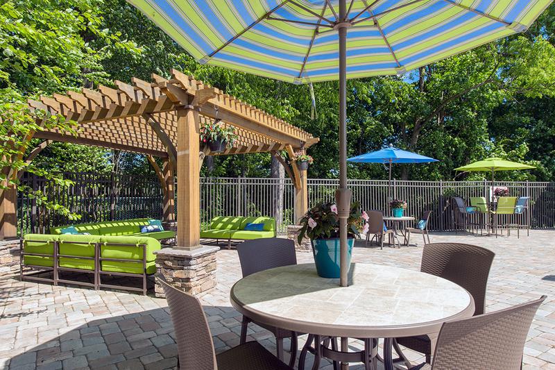 Poolside Cabanas and Tables | Our sundeck features plenty of poolside seating for you to enjoy.