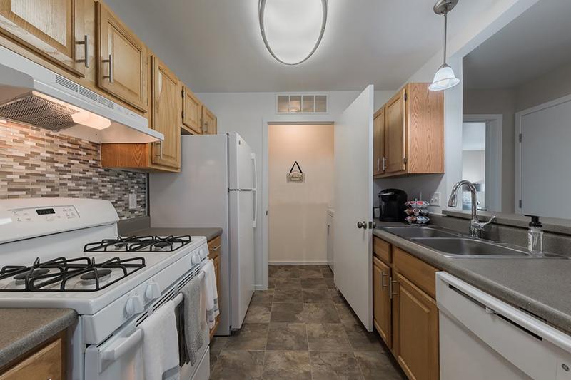 Kitchen | Galley style kitchens featuring a breakfast bar, and a laundry room.